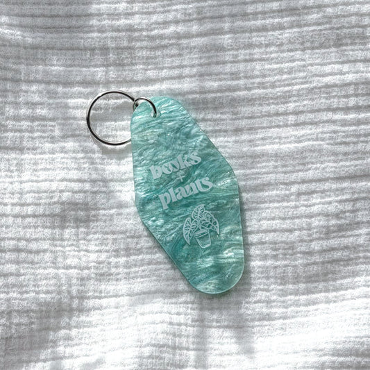 books and plants keychain